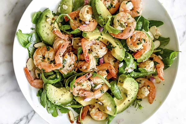 Arugula with tiger shrimp, avocado and tomatoes